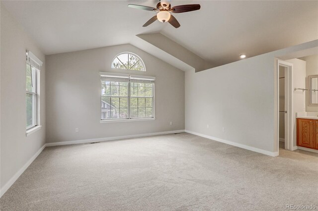 6735 W 97th Cir, Westminster, CO 80021 - unfurnished room with light carpet, ceiling fan, vaulted ceiling, and baseboards
