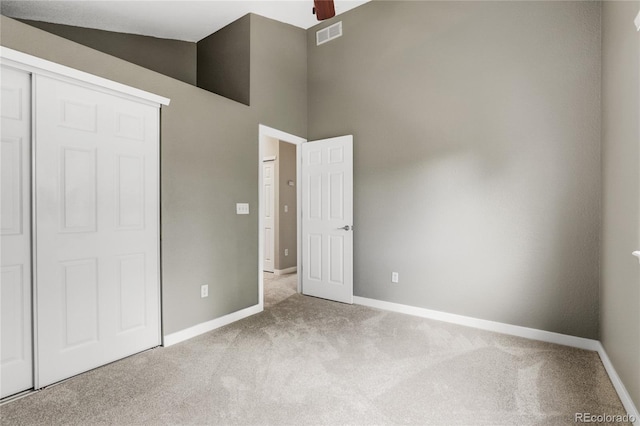 6735 W 97th Cir, Westminster, CO 80021 - unfurnished bedroom with carpet floors, baseboards, a closet, and a towering ceiling