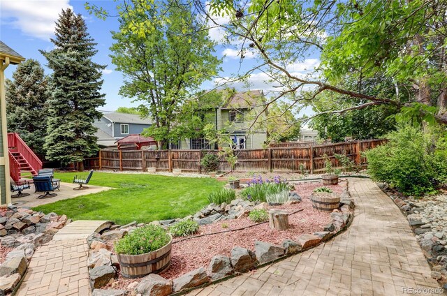 6735 W 97th Cir, Westminster, CO 80021 - view of yard featuring a patio