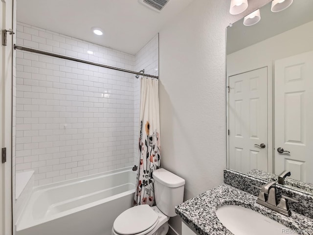 full bathroom featuring vanity, shower / bath combination with curtain, and toilet