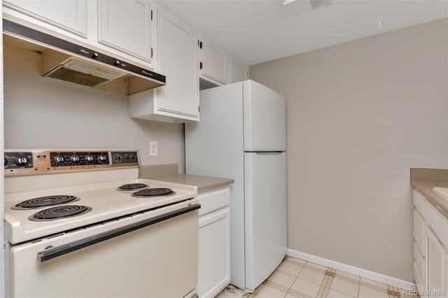 kitchen with white appliances and white cabinets