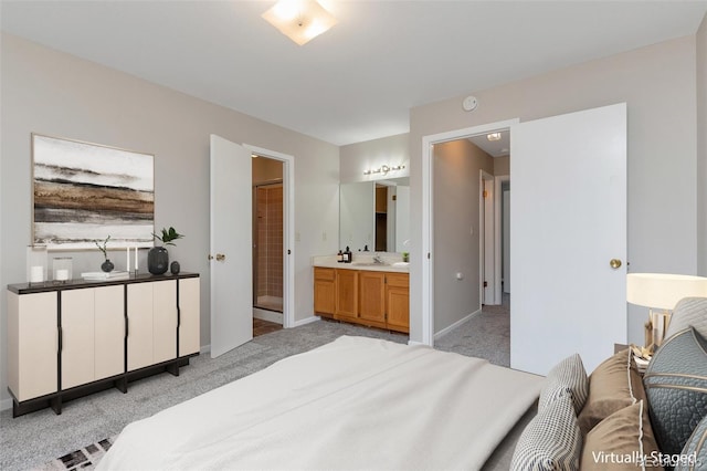 carpeted bedroom with ensuite bathroom