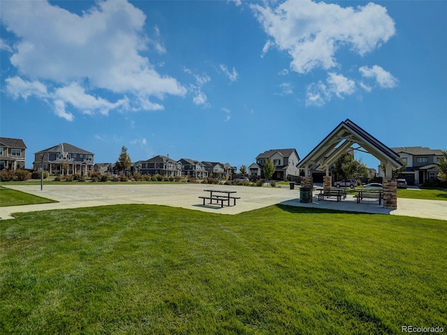 view of home's community with a gazebo and a yard