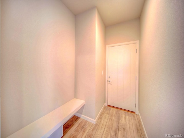 hall with light hardwood / wood-style floors