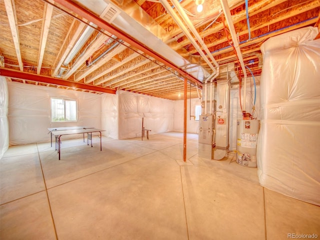 basement with water heater and heating unit