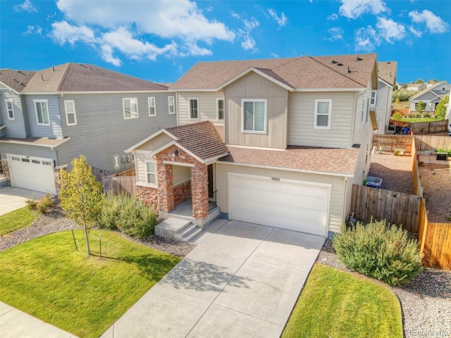 view of front of home featuring a garage and a front lawn