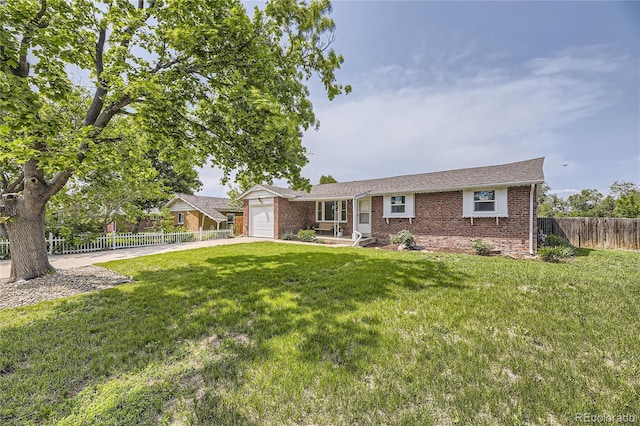 10633 E 6th Pl, Aurora, CO 80010 - ranch-style house with brick siding, a garage, and concrete driveway