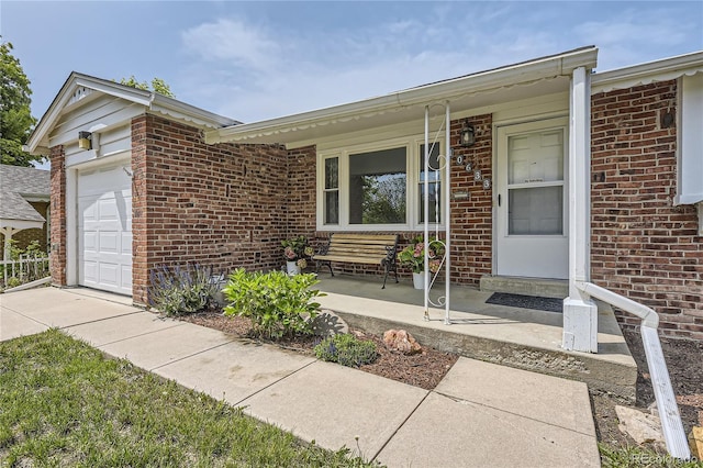 10633 E 6th Pl, Aurora, CO 80010 - view of front facade with brick siding, a garage, and a porch