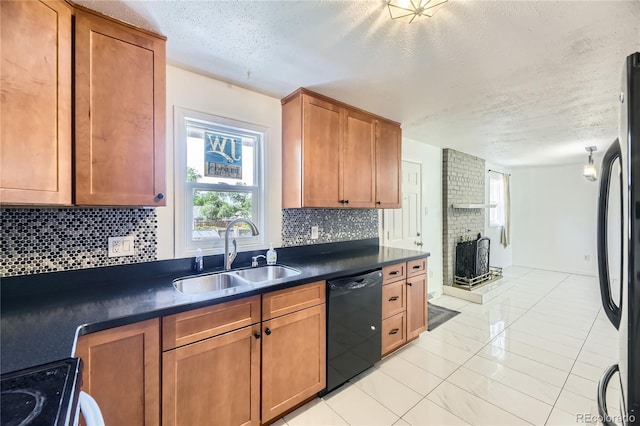 10633 E 6th Pl, Aurora, CO 80010 - kitchen featuring black dishwasher, a sink, a textured ceiling, tasteful backsplash, and dark countertops