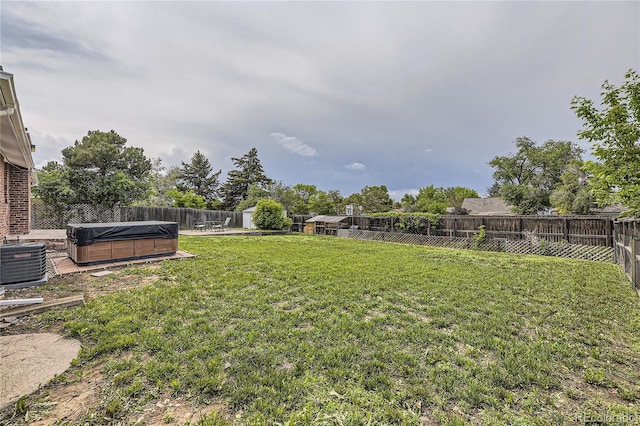 10633 E 6th Pl, Aurora, CO 80010 - view of yard with a hot tub and cooling unit
