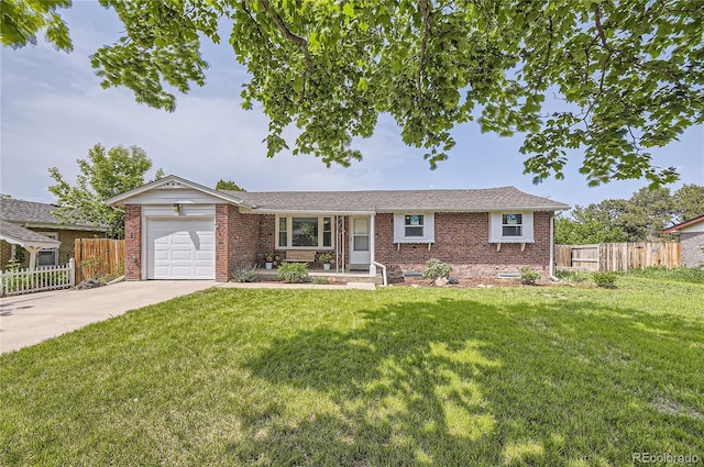 10633 E 6th Pl, Aurora, CO 80010 - ranch-style house featuring brick siding, driveway, and an attached garage