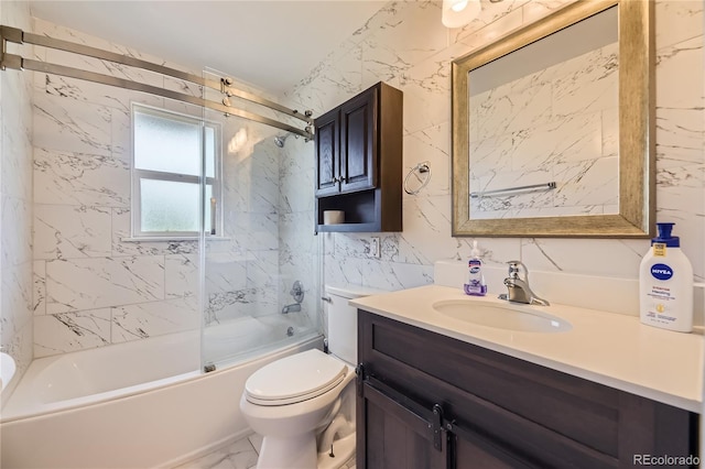 10633 E 6th Pl, Aurora, CO 80010 - full bathroom with vanity, toilet, bath / shower combo with glass door, marble finish floors, and tile walls