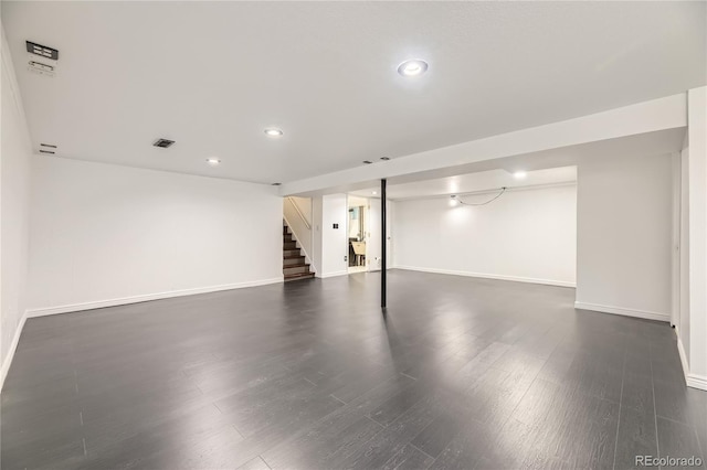 10633 E 6th Pl, Aurora, CO 80010 - finished below grade area featuring baseboards, stairway, recessed lighting, and dark wood finished floors