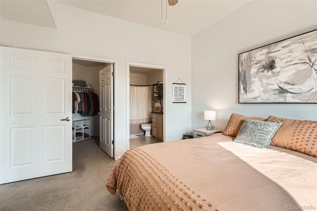 bedroom featuring carpet floors, a closet, ensuite bath, and a spacious closet