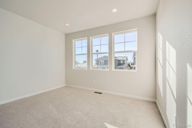 view of carpeted spare room