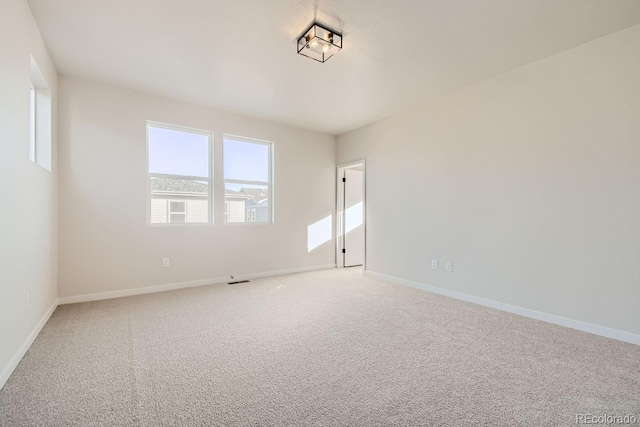 unfurnished room with carpet flooring