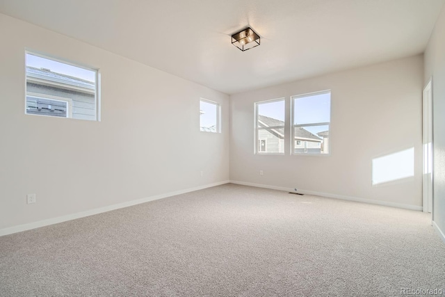 spare room featuring carpet flooring