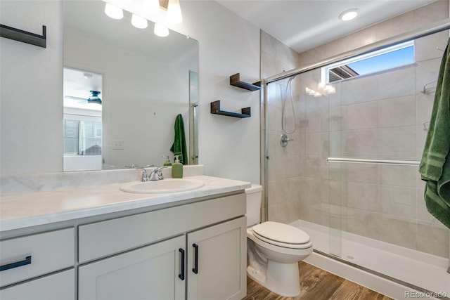 bathroom featuring hardwood / wood-style floors, vanity, a healthy amount of sunlight, and an enclosed shower