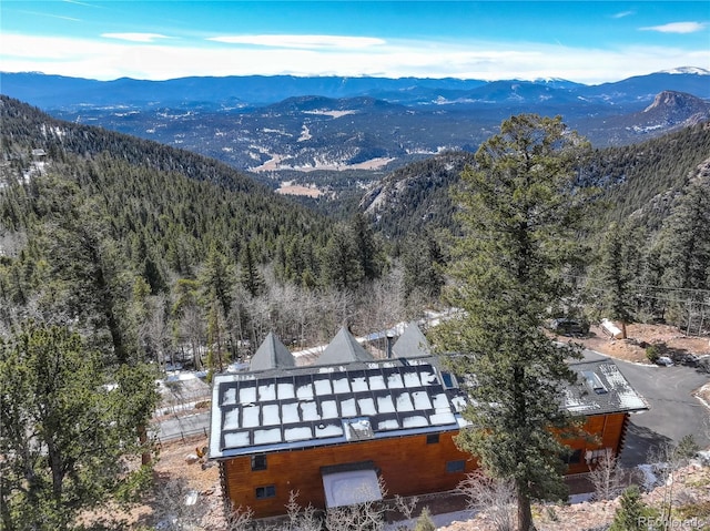 birds eye view of property with a mountain view