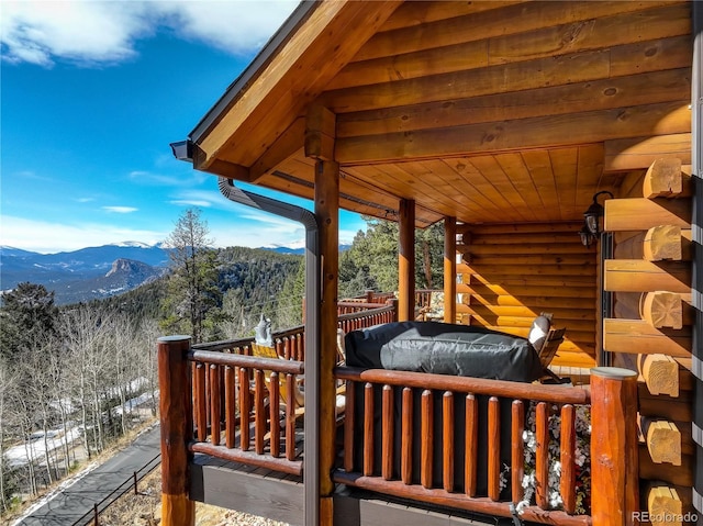 wooden deck with a mountain view