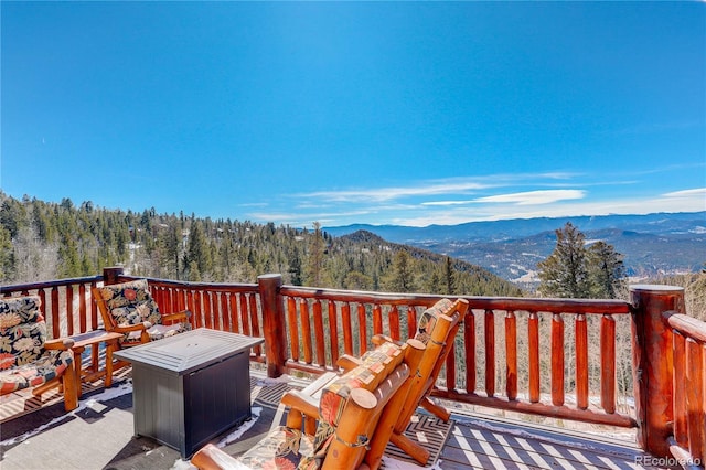 wooden terrace with a mountain view