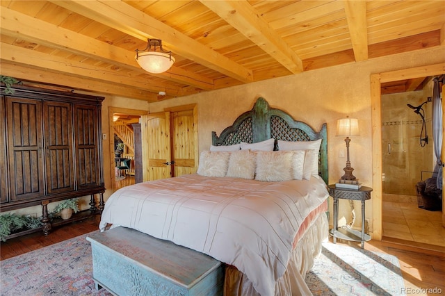 bedroom with beam ceiling, wood ceiling, wood-type flooring, and a spacious closet