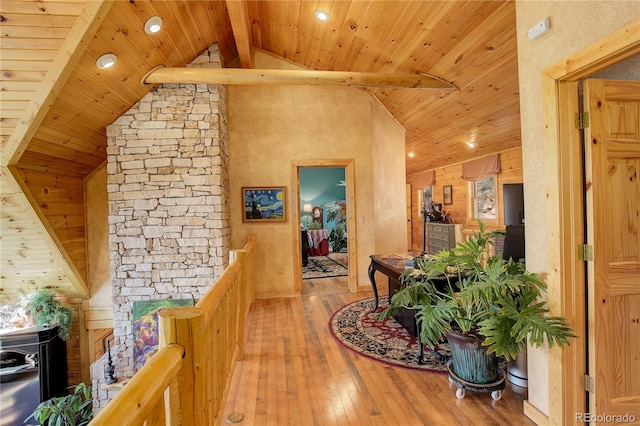 corridor with wood ceiling, wood-type flooring, and lofted ceiling with beams