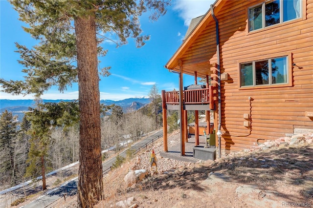 view of side of property with a mountain view