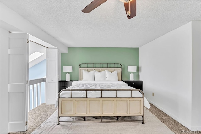 7707 S Curtice Way Unit D, Littleton, CO 80120 - bedroom featuring carpet, a textured ceiling, ceiling fan, and baseboards