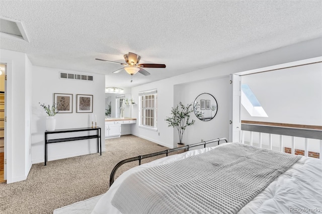 7707 S Curtice Way Unit D, Littleton, CO 80120 - carpeted bedroom featuring a textured ceiling, baseboards, and ceiling fan