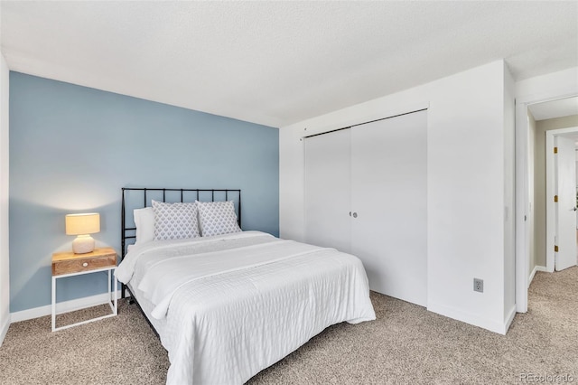 7707 S Curtice Way Unit D, Littleton, CO 80120 - bedroom with carpet flooring, baseboards, and a closet