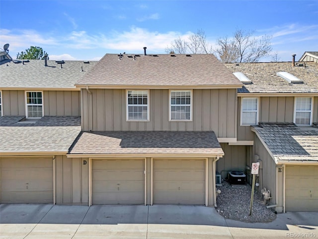 7707 S Curtice Way Unit D, Littleton, CO 80120 - townhome / multi-family property with board and batten siding and an attached garage