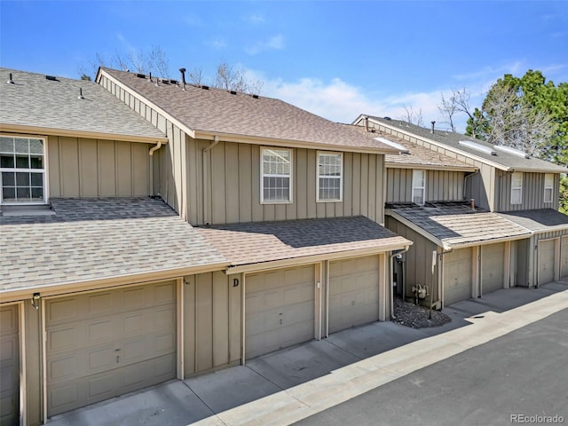7707 S Curtice Way Unit D, Littleton, CO 80120 - view of front of home with board and batten siding and a shingled roof