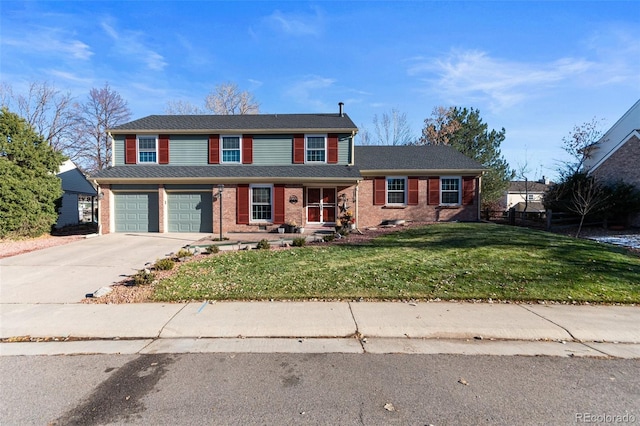 view of front of property featuring a garage and a front yard