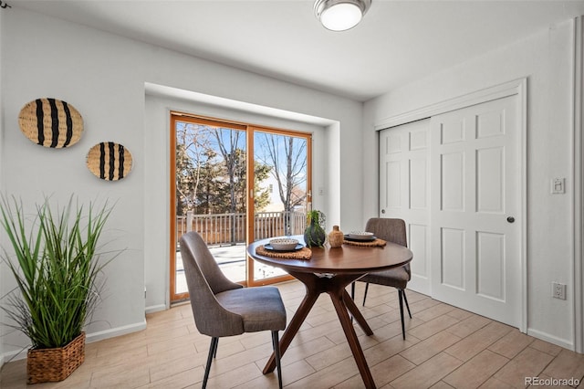 dining area with light hardwood / wood-style flooring