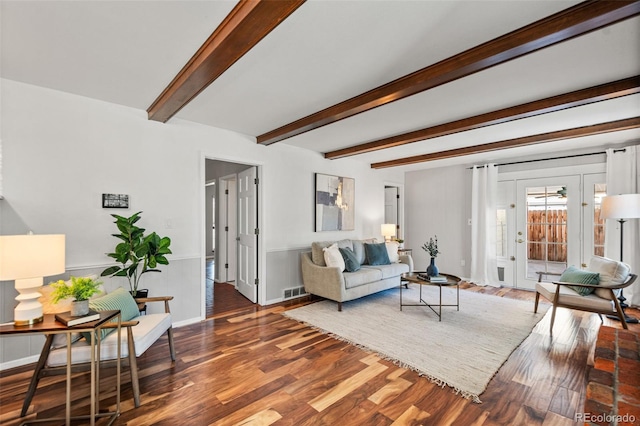 living room with beam ceiling and hardwood / wood-style floors