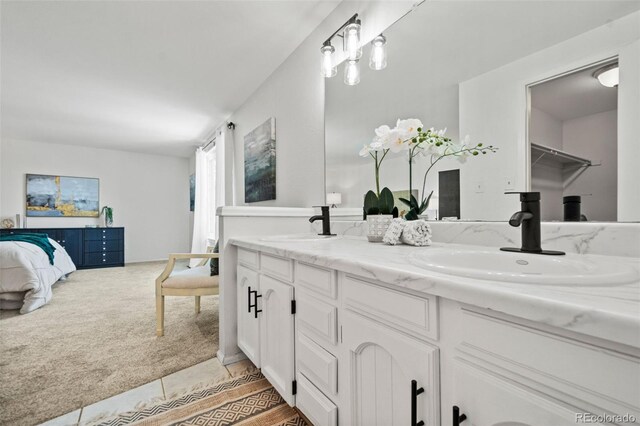 bathroom featuring tile patterned flooring and vanity