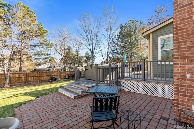 view of patio / terrace with a jacuzzi and a deck