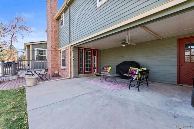 view of patio / terrace featuring ceiling fan, a deck, and area for grilling