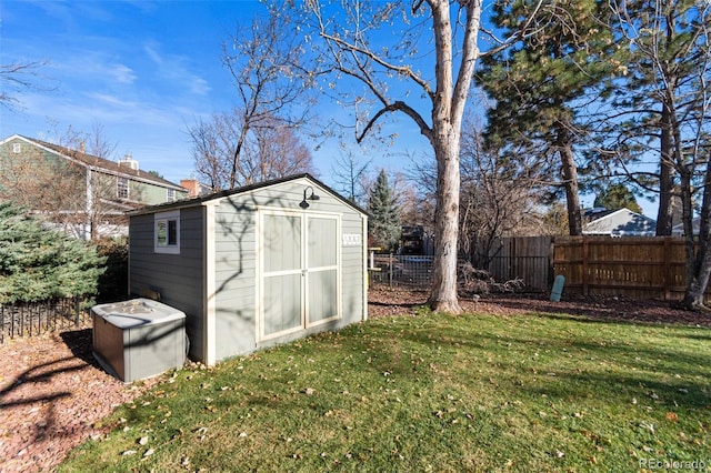 view of outbuilding featuring a yard