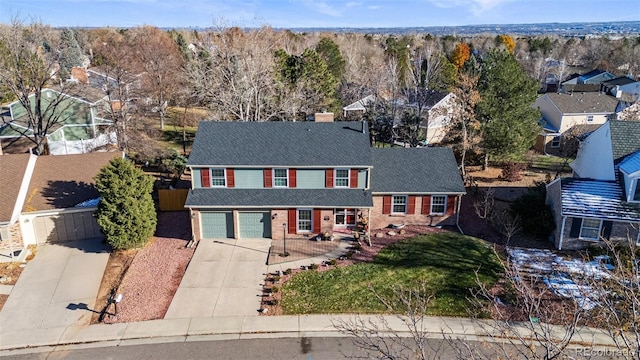 view of front of house with a front yard and a garage