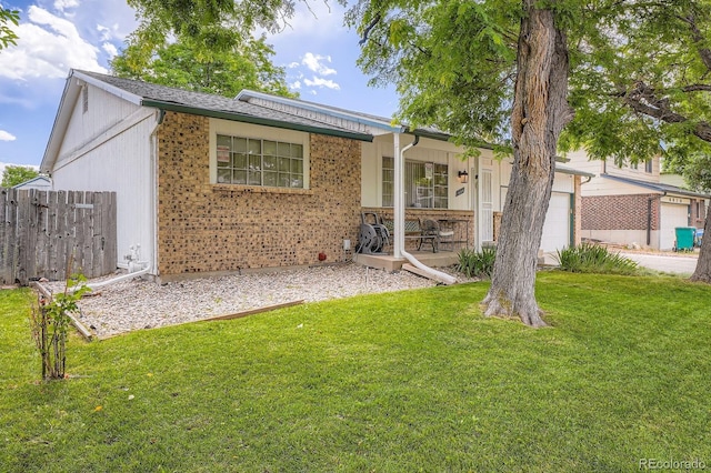 6314 S Johnson St, Littleton, CO 80123 - ranch-style home with a garage, brick siding, and a porch