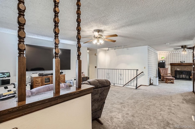 6314 S Johnson St, Littleton, CO 80123 - carpeted living room with a ceiling fan and a glass covered fireplace