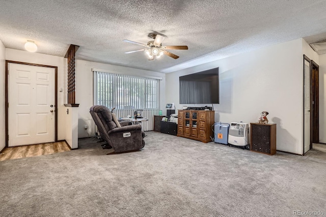 6314 S Johnson St, Littleton, CO 80123 - living area with carpet flooring, ceiling fan, and a textured ceiling