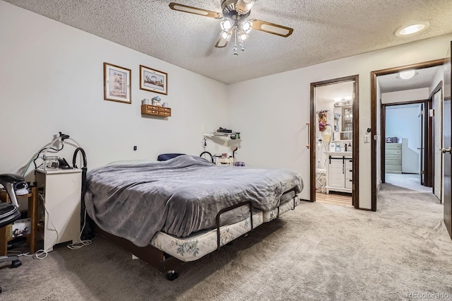 6314 S Johnson St, Littleton, CO 80123 - bedroom featuring light colored carpet, a textured ceiling, a ceiling fan, and connected bathroom