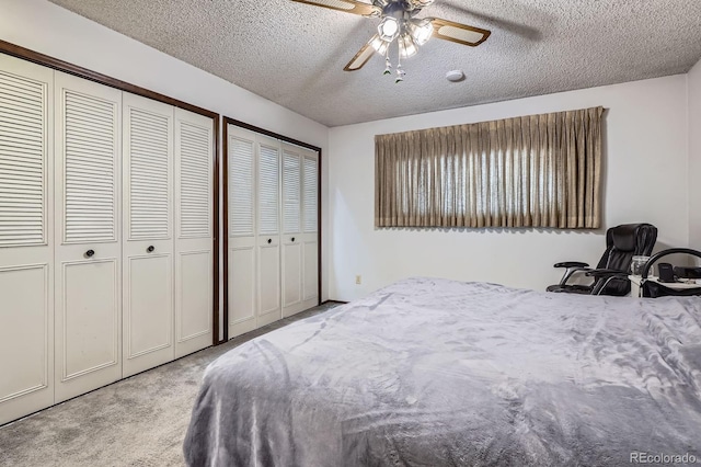 6314 S Johnson St, Littleton, CO 80123 - bedroom with a textured ceiling, multiple closets, light carpet, and ceiling fan
