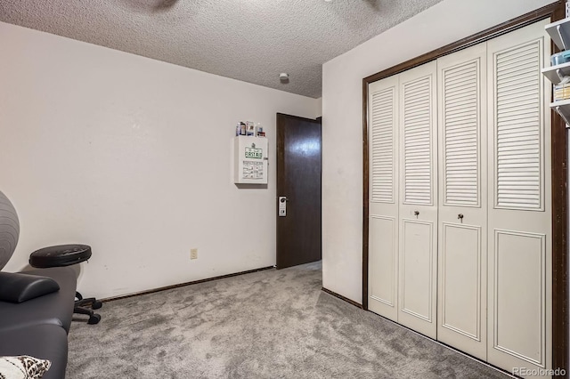 6314 S Johnson St, Littleton, CO 80123 - bedroom with light colored carpet, a closet, and a textured ceiling