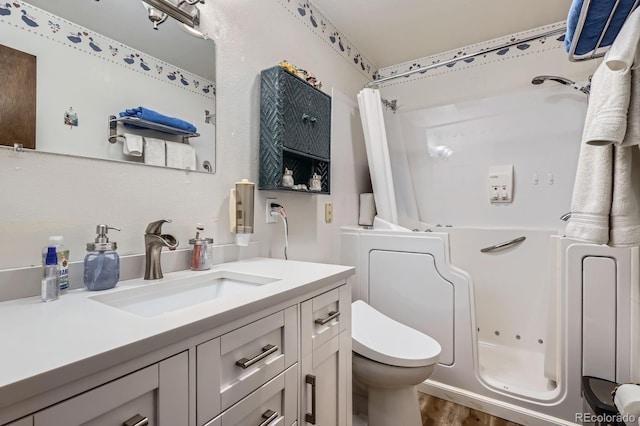 6314 S Johnson St, Littleton, CO 80123 - bathroom featuring vanity and wood finished floors