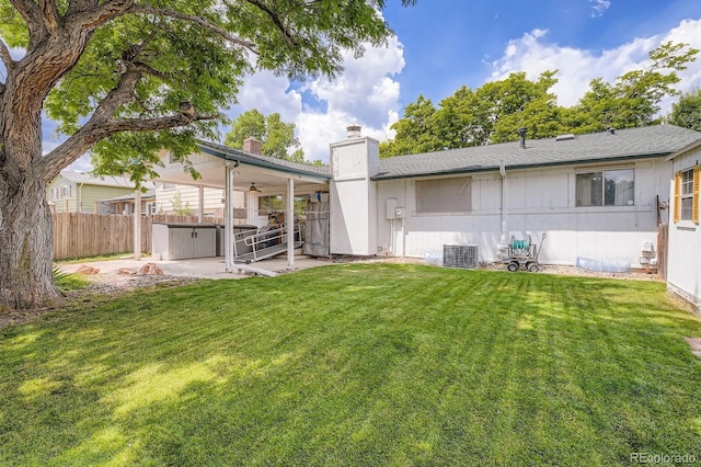 6314 S Johnson St, Littleton, CO 80123 - back of property featuring a patio, a chimney, and roof with shingles