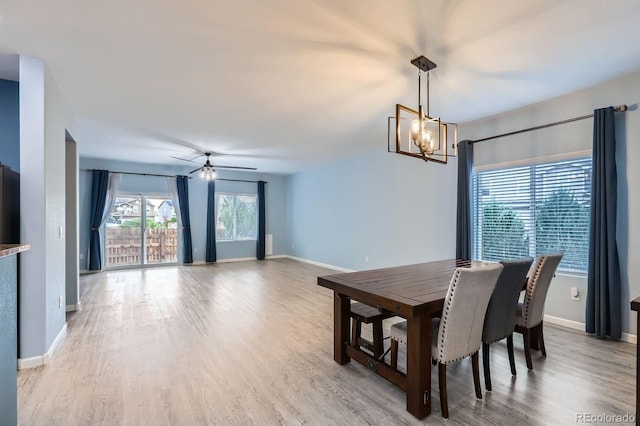 449 Vista Blvd, Lochbuie, CO 80603 - dining room featuring a chandelier, light wood-type flooring, and a ceiling fan